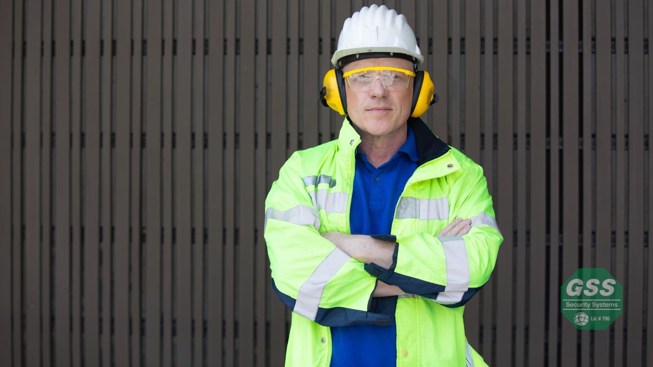 A father checking his GPS tracker and personal safety alarm before a trip.