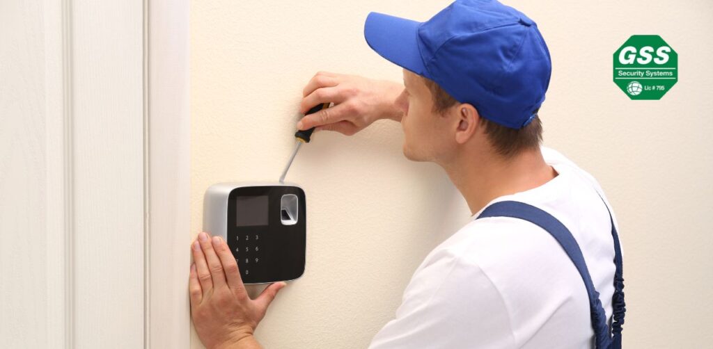 A technician installing a security system in a commercial environment.