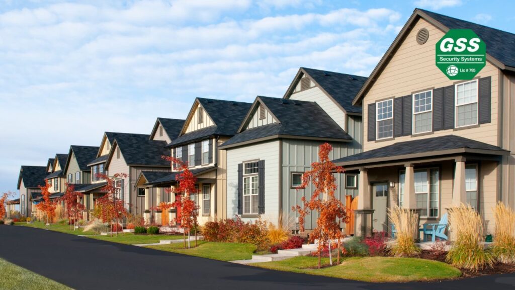 Image of a home during fall with visible outdoor lighting and security systems in place for protection.